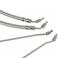 photo of JLM Marine trim ram cylinder hose kit for mercruiser r mr alpha one and bravo i ii iii x xr xz replace hose kit for 9b 104 and 9b 121 trim cylinders 32 864589 32 864588 32 99904q 2 with four braided stainless steel hoses with metal fittings at one end arranged diagonally