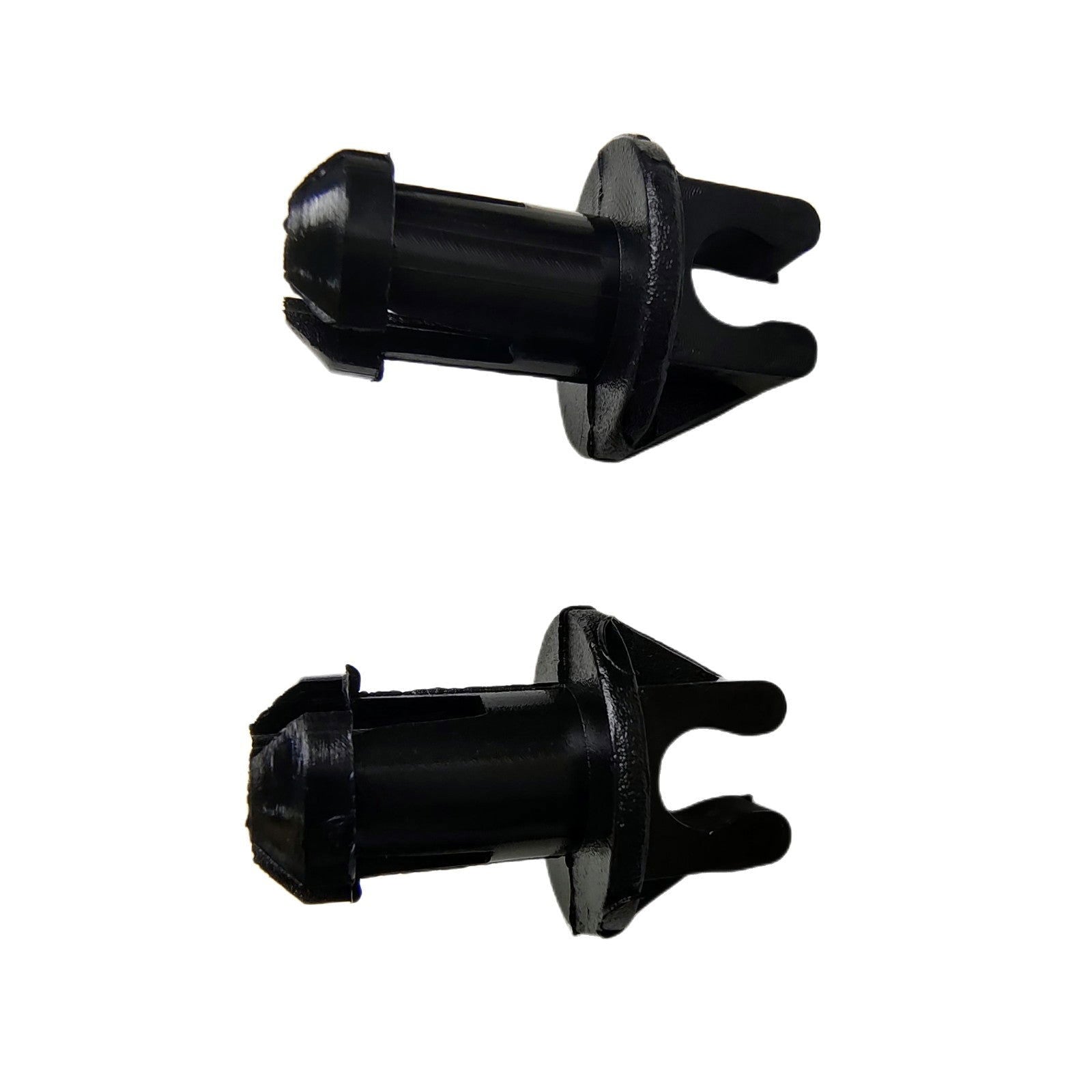 photo of two JLM Marine 23-932481 throttle linkage swivel bushings, black plastic clips with flared textured heads and split pronged ends, viewed at an angle