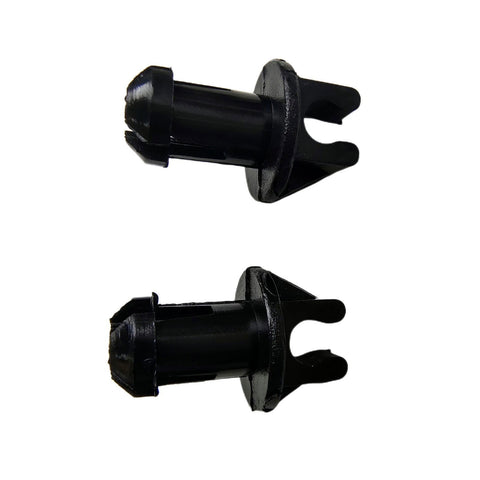 photo of two JLM Marine 23-932481 throttle linkage swivel bushings, black plastic clips with flared textured heads and split pronged ends, viewed at an angle