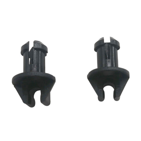photo of two black plastic swivel bushings for mercury mercruiser 23-932481 with flat circular heads and split pronged stems