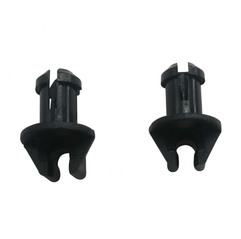 photo of two black plastic throttle linkage swivel bushings for mercury mercruiser 23-932481, showing cylindrical stems, split tops, conical bases, and U-shaped openings